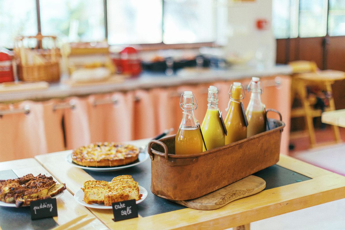 A breakfast buffet with various food items and beverages.