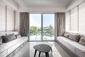 Superior Suite | Living room | Flat-screen TV, DVD player