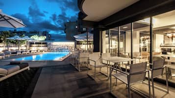 Seasonal outdoor pool, pool umbrellas, pool loungers
