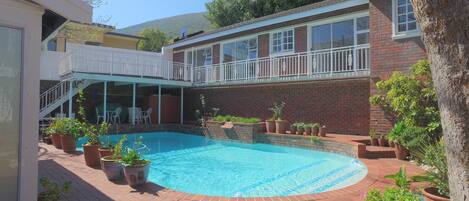 Outdoor pool, pool umbrellas, sun loungers