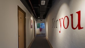 A hallway with a sign reading "For you" on the wall. - 10 Park Street Hotel & Banquets (Gorakhpur)