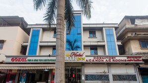 A building with a Gokul Veg & Non Veg Restaurant, a CMIE Inn, and a dormitory with A/C and non A/C rooms. - OYO 3551 Hotel Elite Inn (Navi Mumbai)