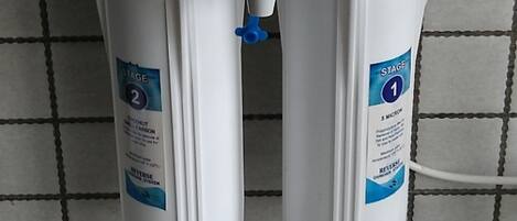 Two water filtration systems labeled "Aqua RO Systems" with contact information.