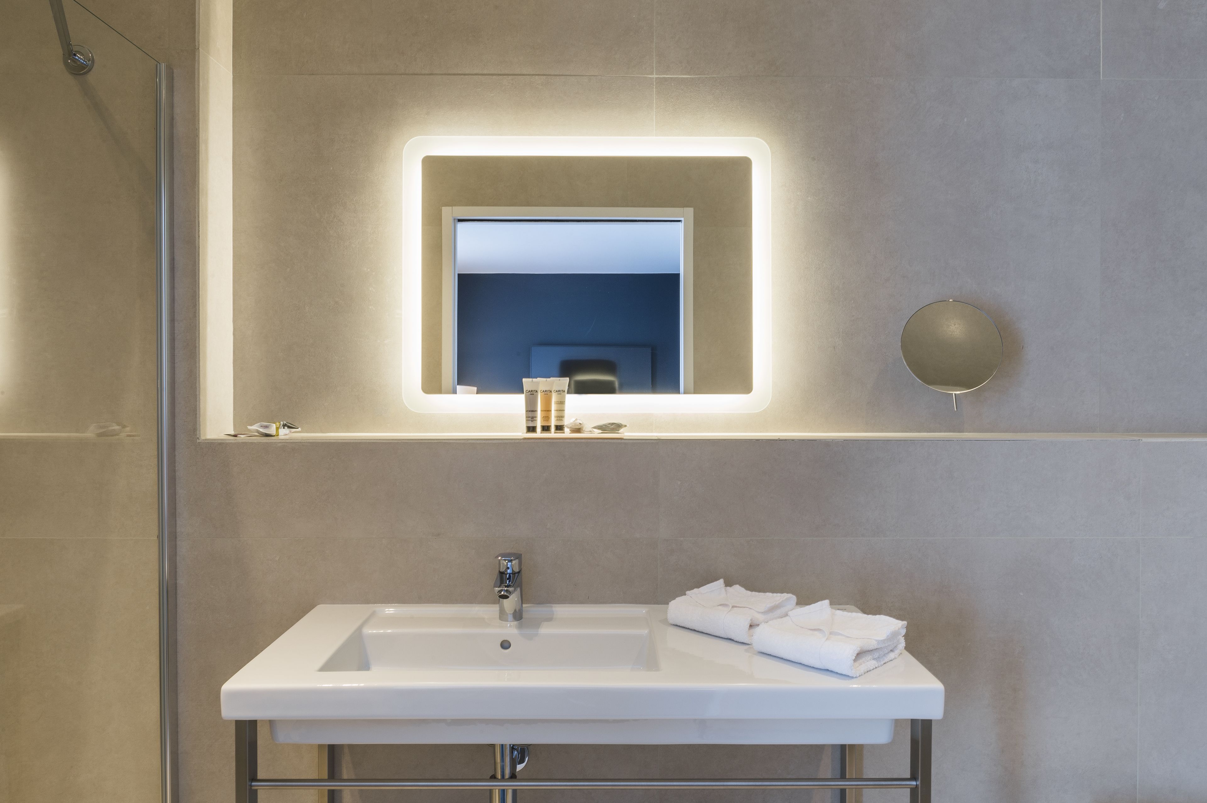 eco-friendly toiletries, hair dryer, towels