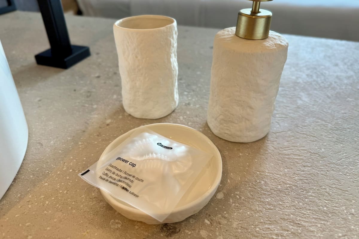 shower, rainfall showerhead, hair dryer, towels