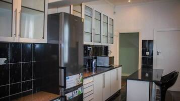 City House, 3 Bedrooms | Private kitchen | Full-sized fridge, microwave, stovetop, coffee/tea maker