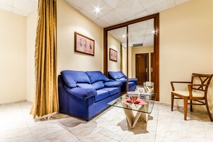 Suite junior | Zona de estar | Una televisión de pantalla plana