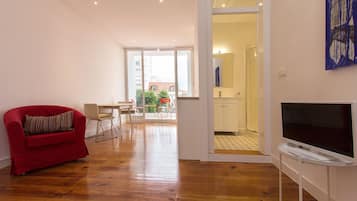 Apartment, 1 Bedroom, Balcony | Living area | Flat-screen TV