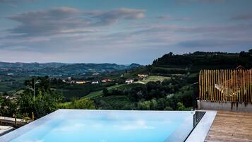 Seasonal outdoor pool, open 9:00 AM to 7:00 PM, pool umbrellas