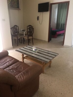 Economy Apartment, 1 Bedroom | Desk, iron/ironing board, free WiFi, bed sheets