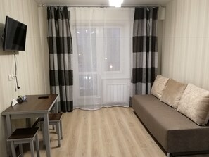 Apartment, 1 Bedroom (Zvereva 1/2) | Living room | Flat-screen TV - Hotel in Apartment Irkutsk (Irkutsk)