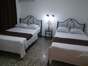 Twin Room | Minibar, in-room safe, iron/ironing board, bed sheets