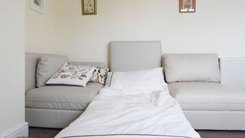 1 bedroom, desk, iron/ironing board, travel crib