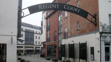 A building with a sign reading "REGENT COURT" above the entrance.