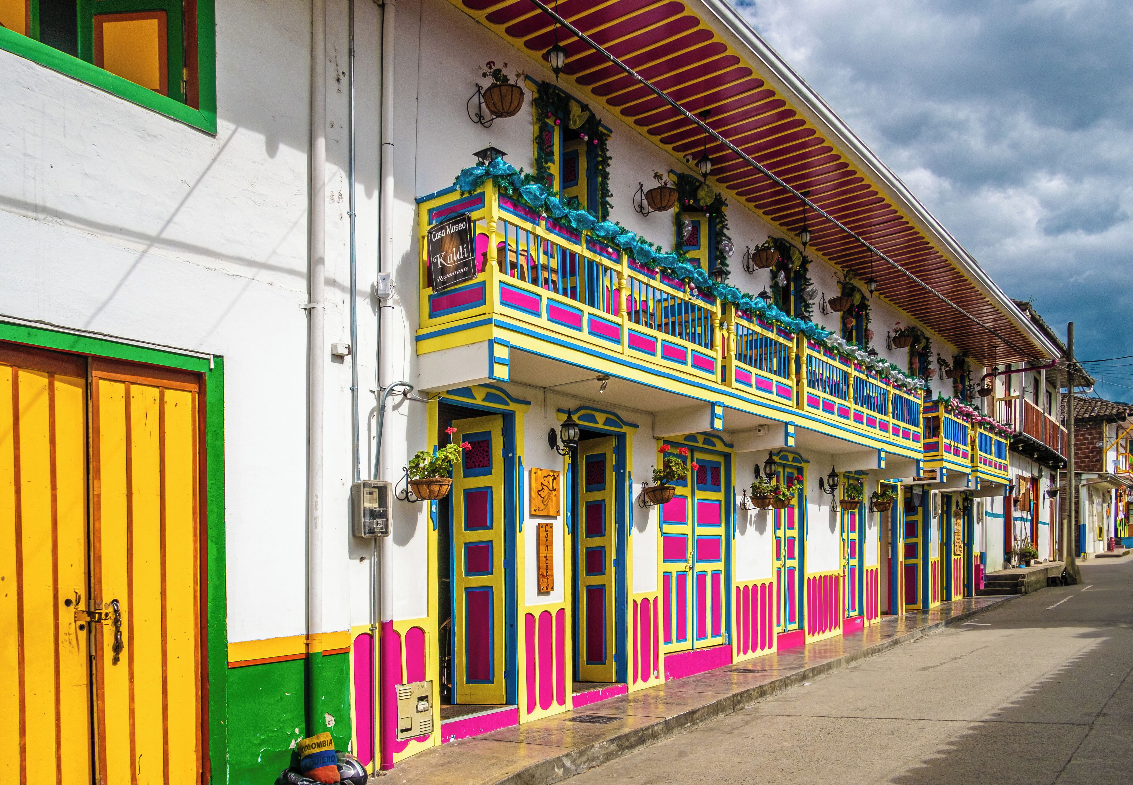 A colorful building with balconies and doors.