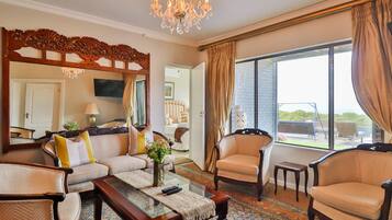 Superior Room 2 | Living area | 40-inch LCD TV with satellite channels, TV