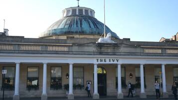 A building with a large dome and the name "The Ivy" on the facade.