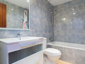 Bathtub, hair dryer, towels