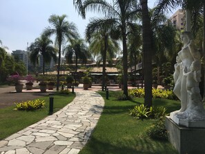 Stroll through the beautifully maintained garden, featuring a variety of plants and a tranquil atmosphere.