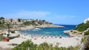 On the beach, sun loungers