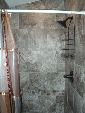 Shower, hair dryer, towels, shampoo