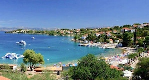 A coastal town with a marina, beach, and residential buildings. - Villa Sol - private heated pool & 30m from the sea (Necujam)