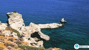 A coastal landscape with rocky cliffs and clear blue sea. - Grande Blue Suites with private bay (Rhodes)