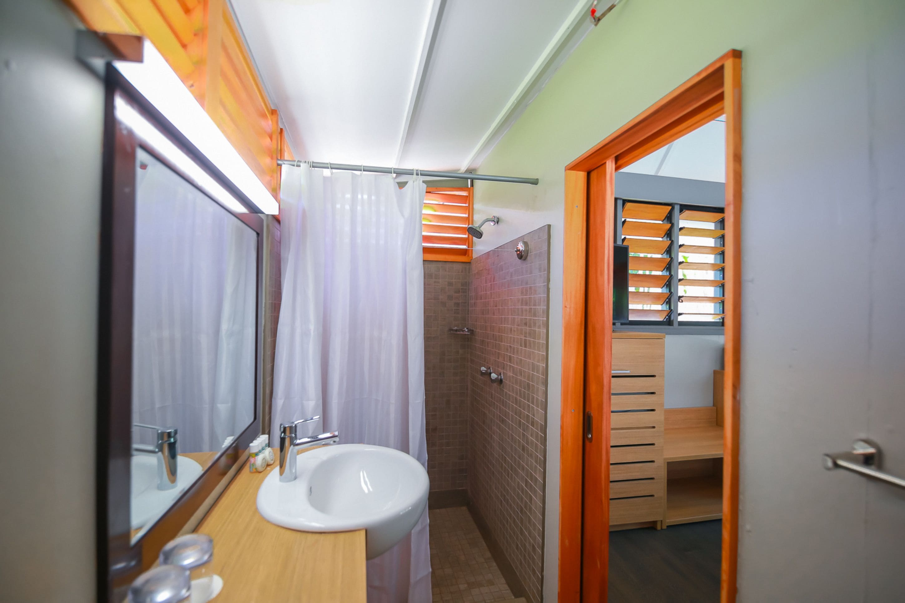 shower, hair dryer, bathrobes, slippers