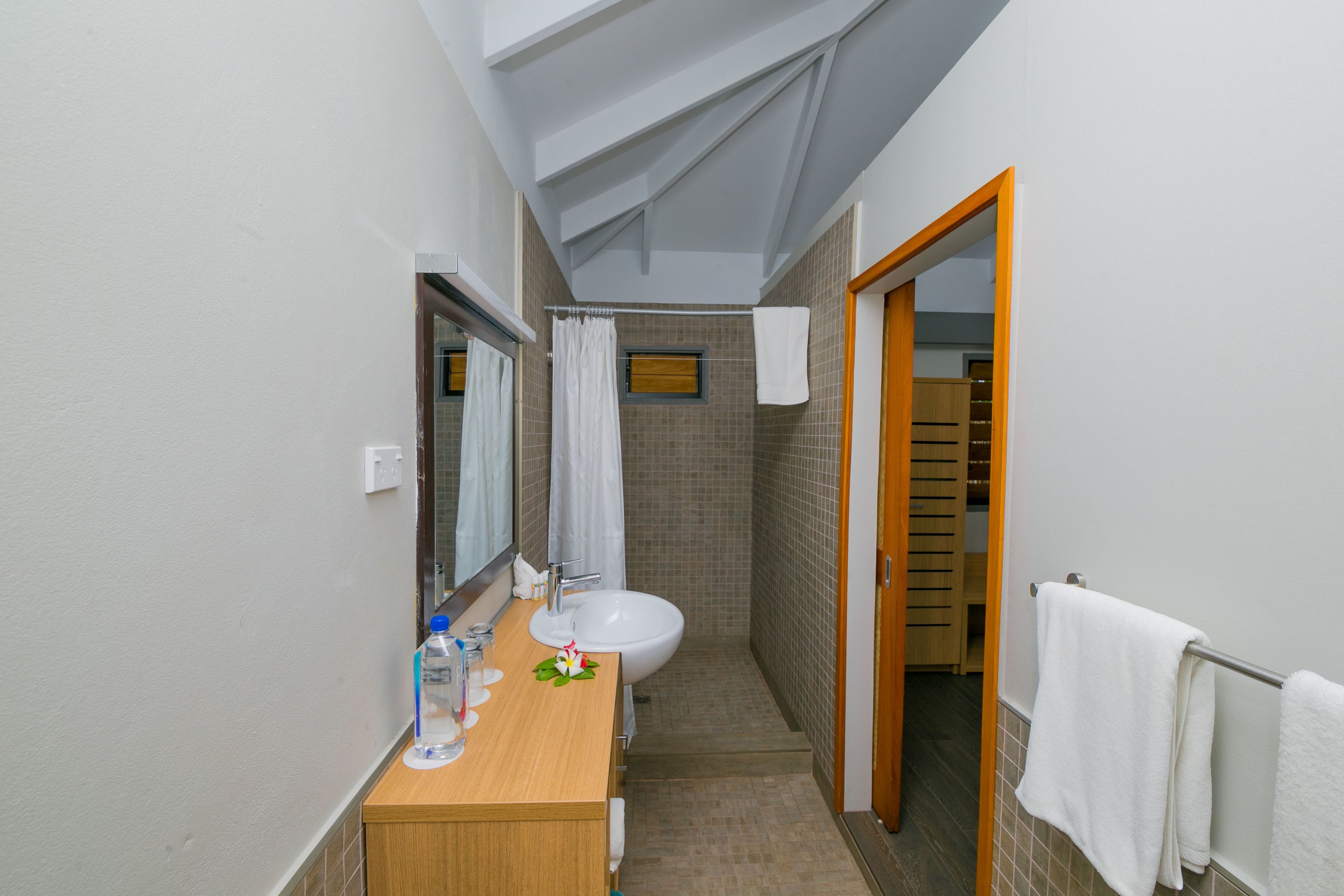 shower, hair dryer, bathrobes, slippers