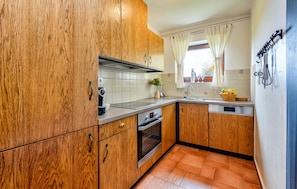 Fridge, stovetop, dishwasher, coffee/tea maker