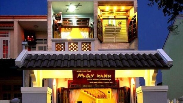 A two-story building with a shop on the ground floor and a restaurant on the upper floor. - Blue Clouds Homestay (Da Nang)
