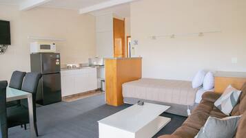 Fridge, microwave, stovetop, coffee/tea maker