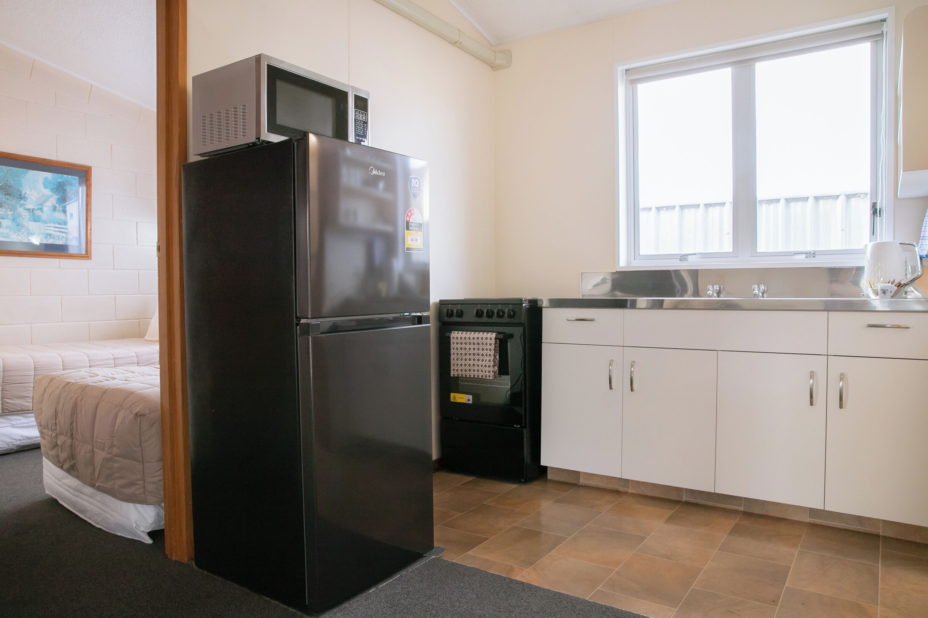 Deluxe Family Room, 2 Bedrooms | Private kitchen