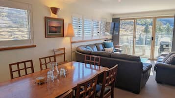 12 Share Superior Deluxe A 4 Bedroom | Living area | 50-inch Smart TV with satellite channels