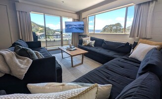 12 Share Superior Deluxe B 4 Bedroom | Living room | 50-inch Smart TV with satellite channels