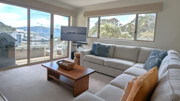 4 Share Superior Deluxe 3 Bedroom | Living area | 50-inch Smart TV with satellite channels