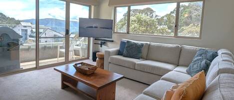 4 Share Superior Deluxe 3 Bedroom | Living area | 50-inch Smart TV with satellite channels
