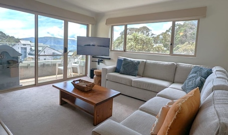 4 Share Superior Deluxe 3 Bedroom | Living area | 50-inch Smart TV with satellite channels