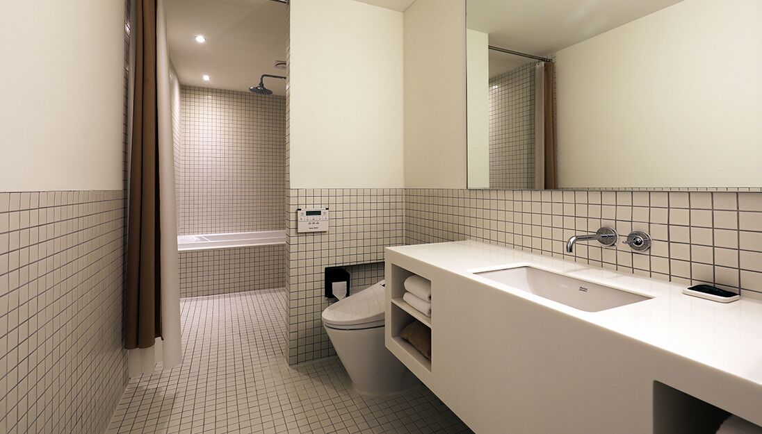 penthouse glamping | bathroom | hair dryer, bathrobes, slippers, bidet