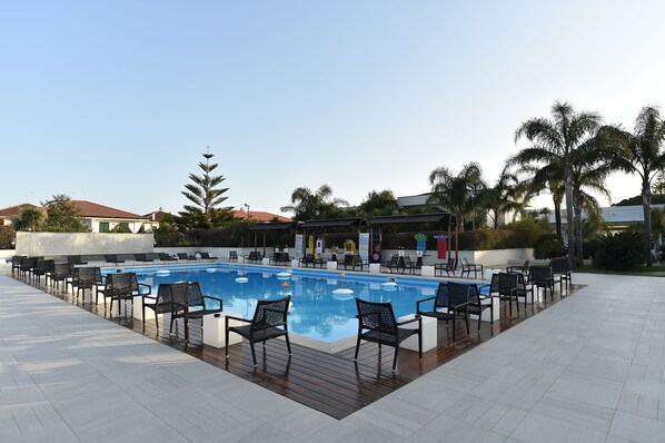 Outdoor pool, open 8:00 AM to 12:30 PM, pool loungers