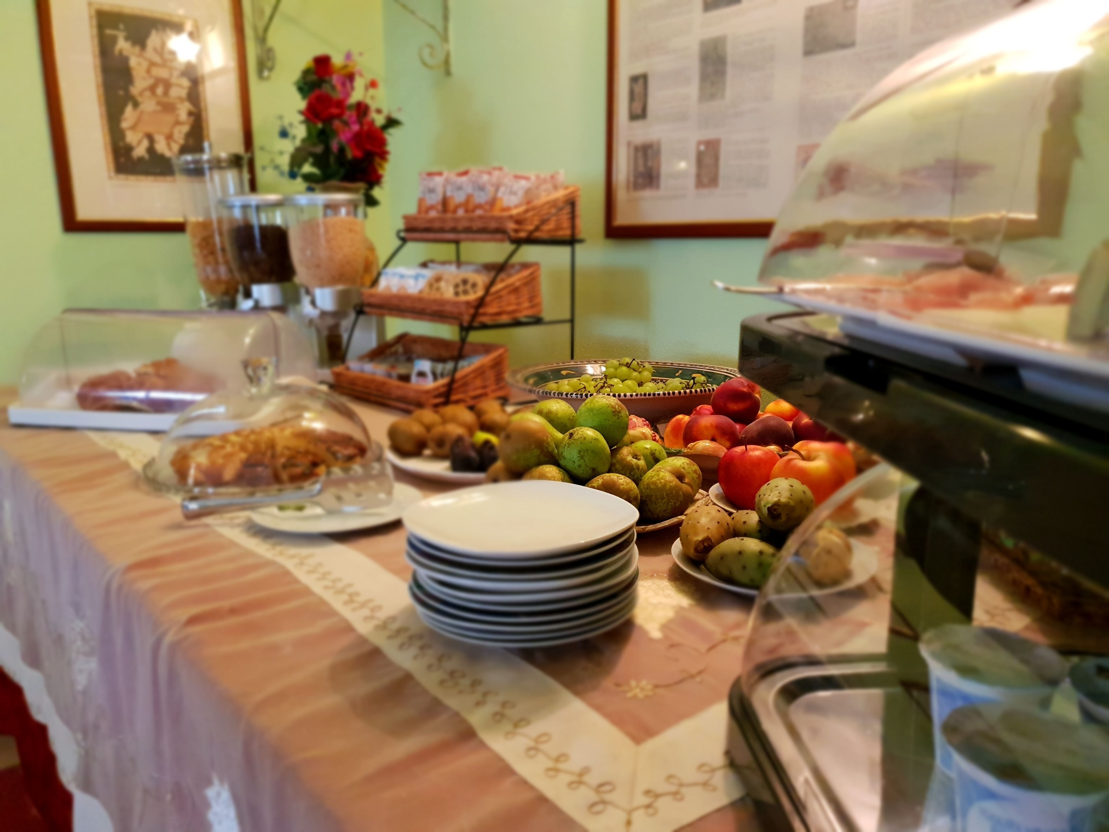 A buffet table with various food items and a coffee machine.