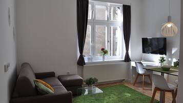 Deluxe studio | Een kluis op de kamer, een bureau, geluiddichte muren, gratis babybedden