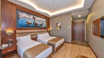 Deluxe Double or Twin Room | Minibar, in-room safe, desk, blackout drapes