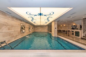 Indoor pool, seasonal outdoor pool, open noon to 10 PM, pool loungers