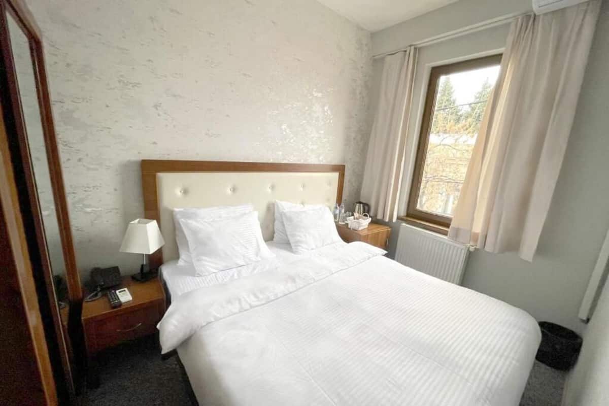 Habitación cuádruple familiar | Ropa de cama de alta calidad, cortinas blackout y insonorización