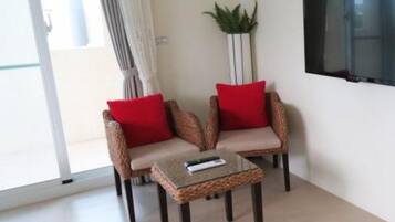 Family Quadruple Room | Living area | LCD TV