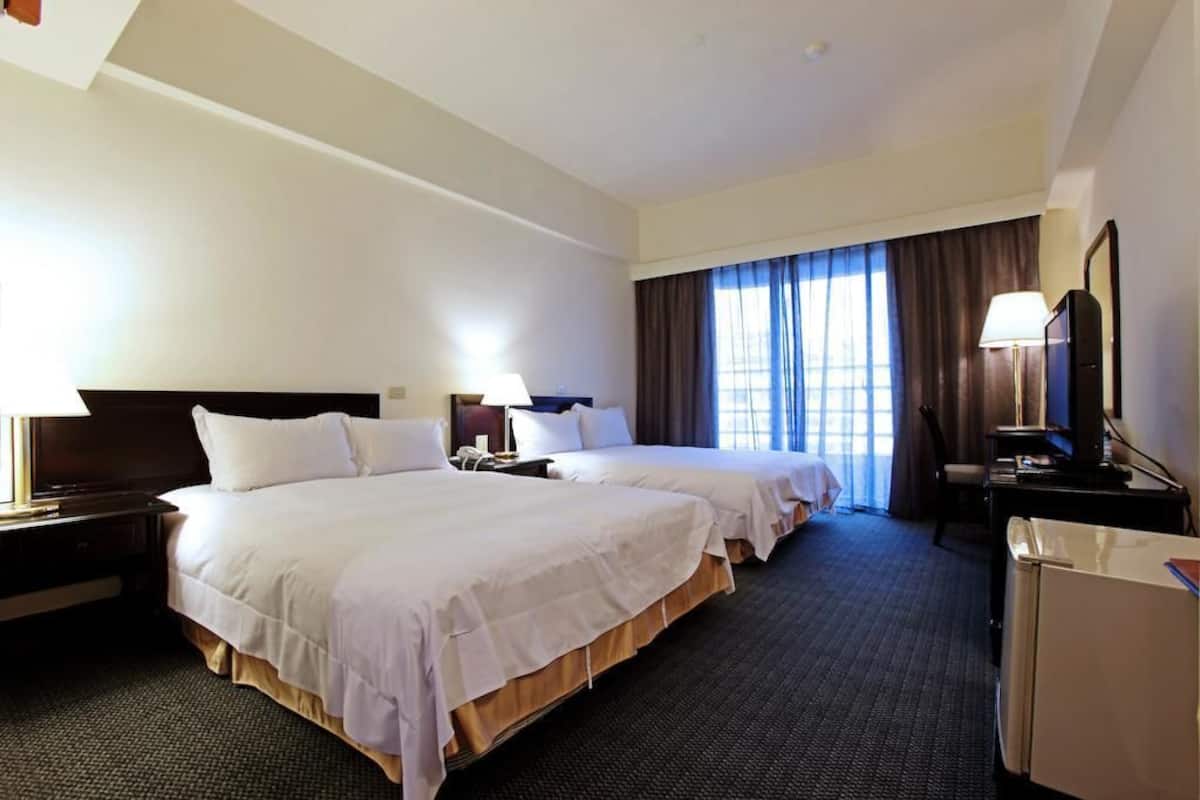 quadruple room | down duvets, desk, laptop workspace, blackout curtains