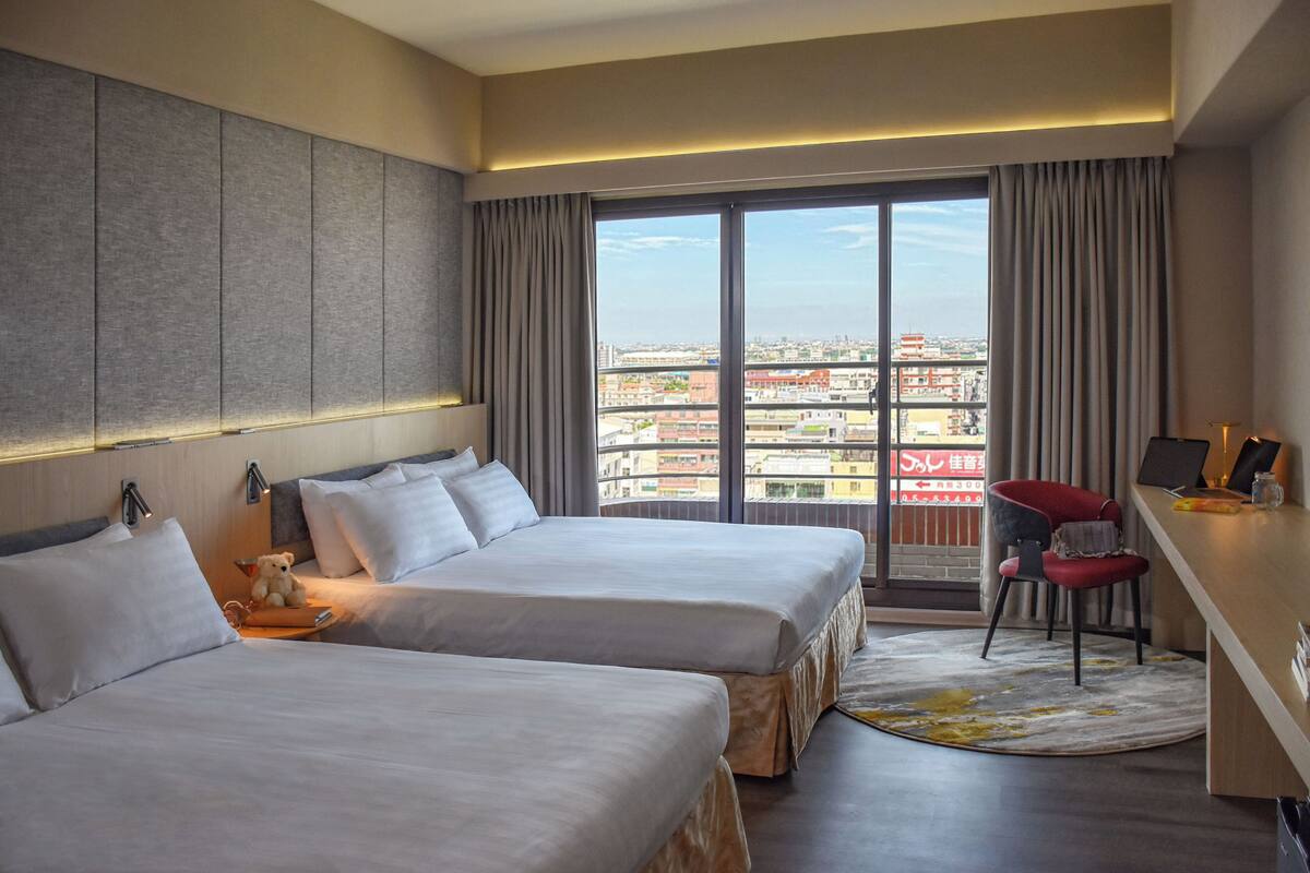 Deluxe Quadruple Room | Down comforters, desk, laptop workspace, blackout drapes
