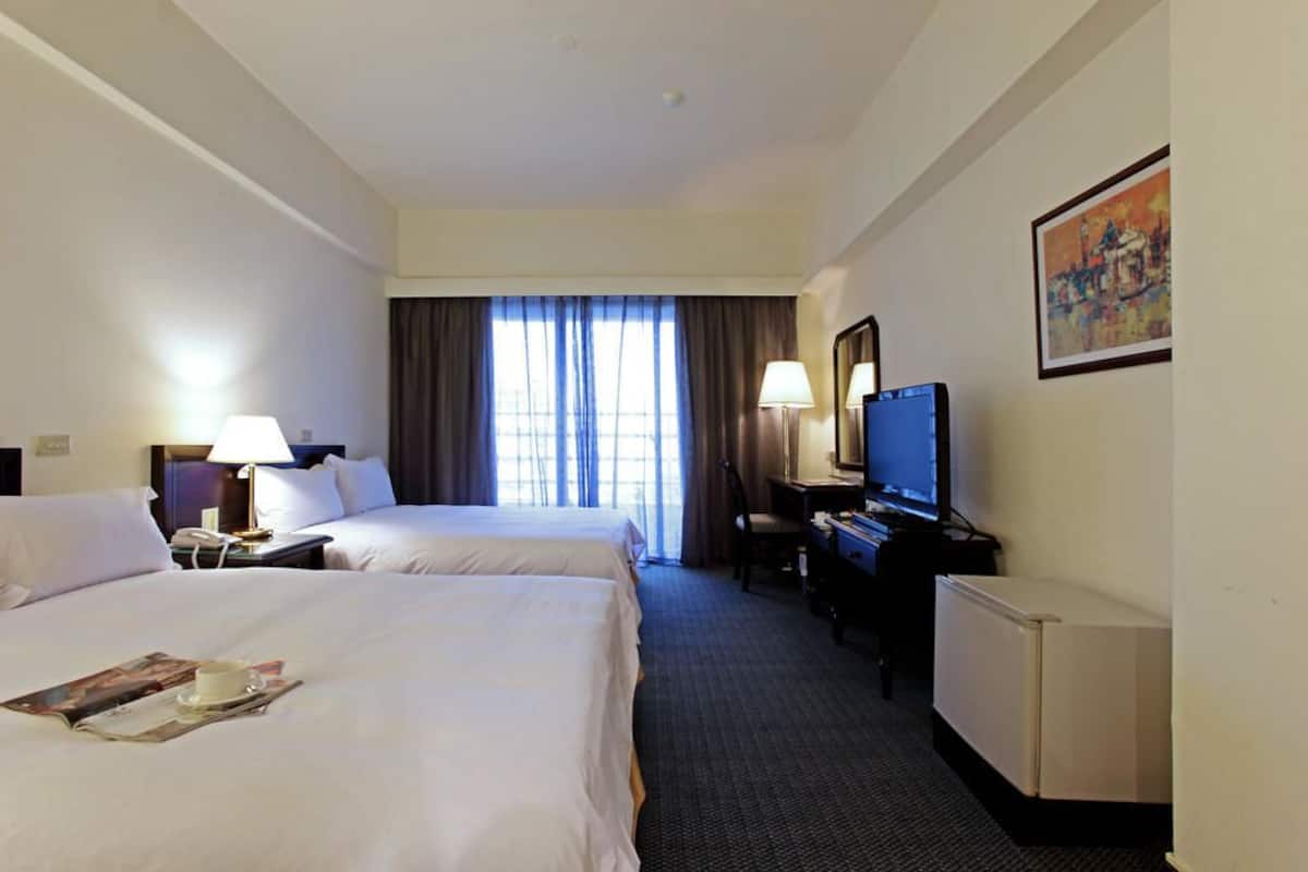 quadruple room | down duvets, desk, laptop workspace, blackout curtains