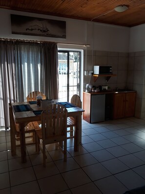 Comfort Triple Room, 2 Bedrooms, Pool Access, Pool View | In-room dining